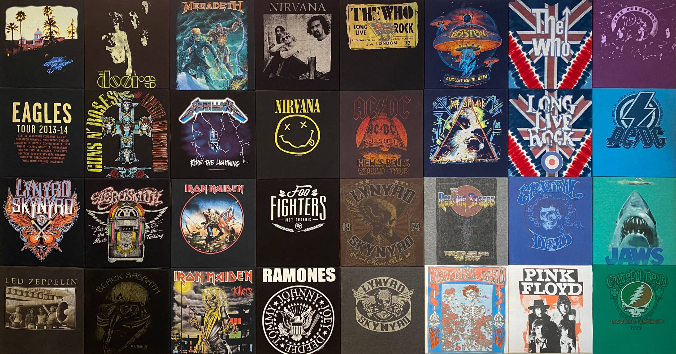 rock and metal music tshirts hung on square canvases in a grid pattern on a wall